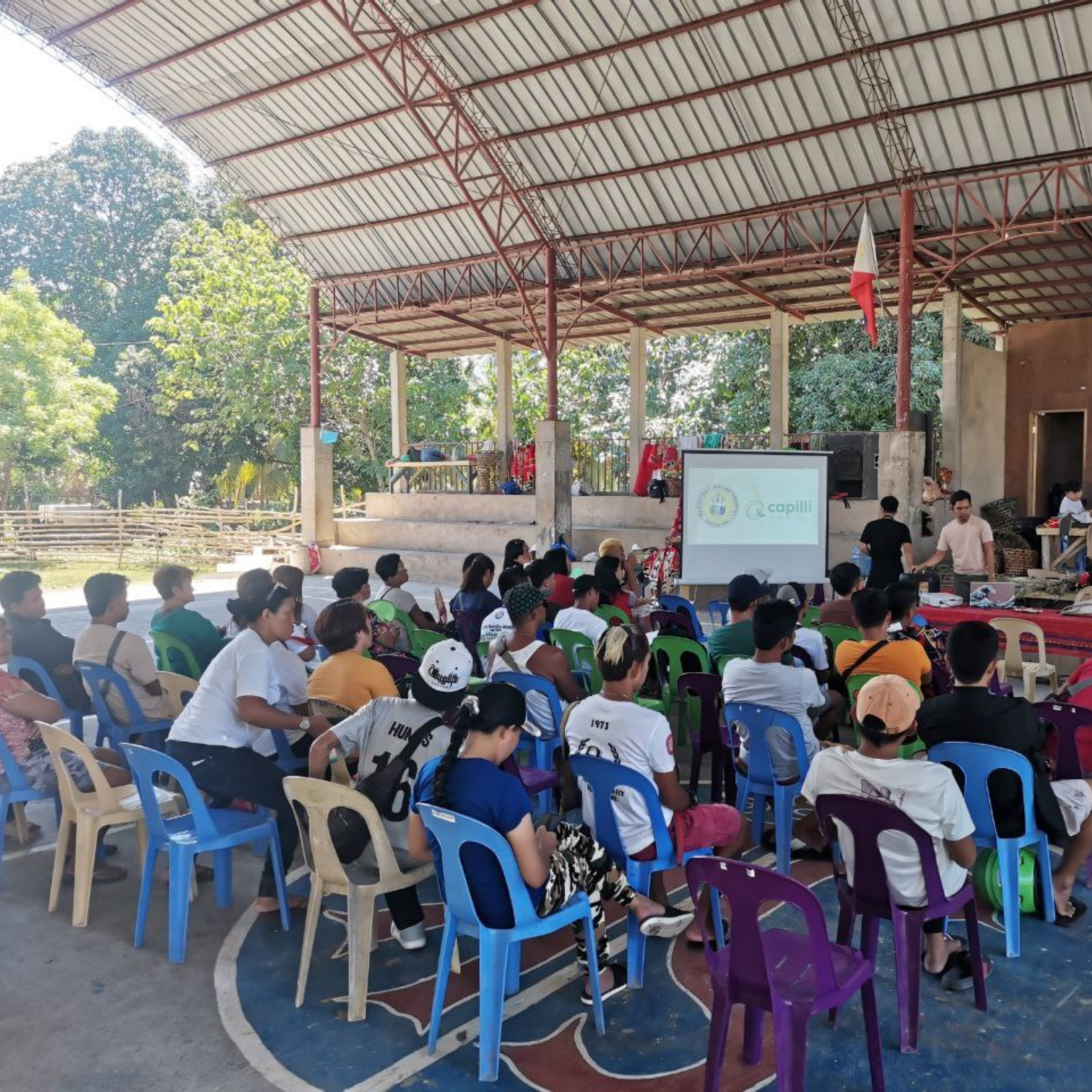 Capilli Trading team engaging with local community members during a sustainability workshop on repurposing hair waste