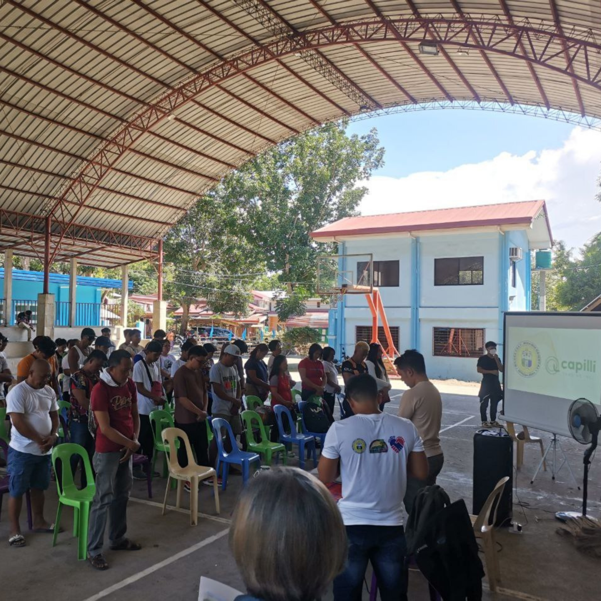 Capilli Trading team engaging with local community members during a sustainability workshop on repurposing hair waste